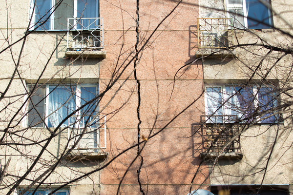 High rise building with cracks