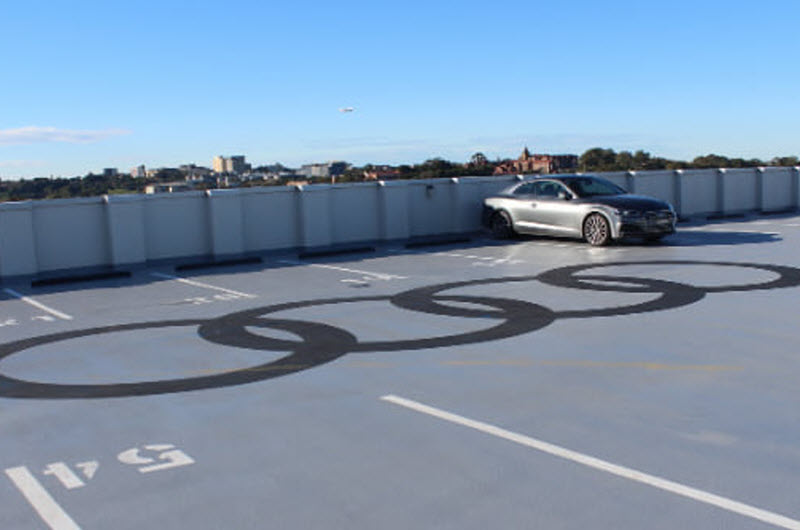 Gray car in a parking lot